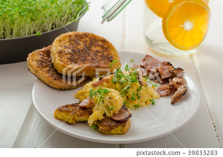 Scrambled eggs with French toast topped with watercress Scrambled eggs with watercress, french toast Scrambled eggs with French toast topped with watercress Scrambled eggs with watercress, french toast 39833283