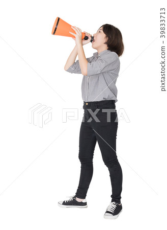 Young woman shouting for announce through a megaphone Young woman shouting for announce through a megaphone 39833713