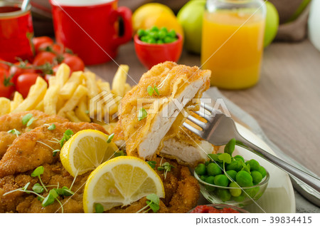 Schnitzel, french fries and microgreens salad Schnitzel, french fries and microgreens salad 39834415