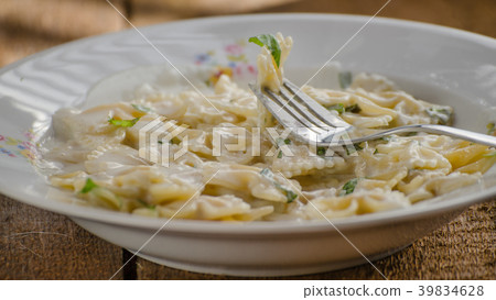 Fresh pasta with cheese, creame and basil Fresh pasta with cheese, creame and basil 39834628