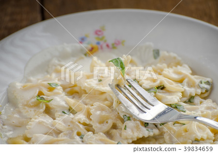 Fresh pasta with cheese, creame and basil 39834659