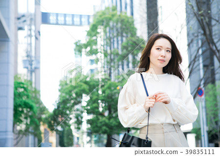 A young lady walking in the city A young lady walking in the city 39835111