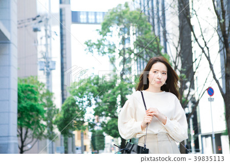 A young lady walking in the city A young lady walking in the city 39835113