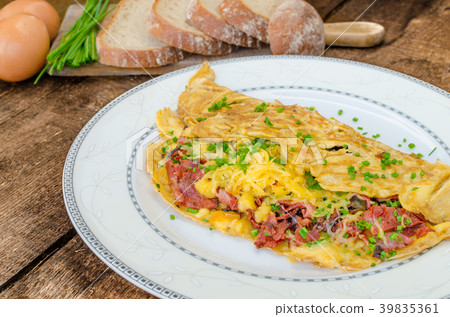 Omelet with bacon and cheese Omelet with bacon and cheese 39835361
