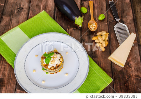 Grilled eggplant with feta cheese,parmesan basil, nuts Grilled eggplant with feta cheese,parmesan basil, nuts 39835383