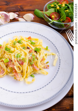 Italian pasta with spring onion and bacon 39835684