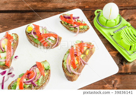 Brown bread with avocado, smoked salmon, boiled egg Brown bread with avocado, smoked salmon, boiled egg 39836141