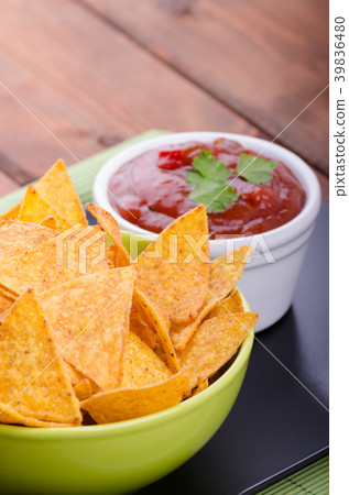 Tortilla chips with spicy tomato salsa 39836480