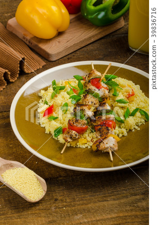 Couscous with vegetables and chicken skewer 39836716