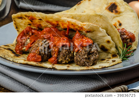 Indian naan with meatballs and tomato sauce Indian naan with meatballs and tomato sauce 39836725