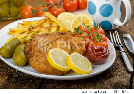 Big Chicken schnitzel with homemade chilli french fries 39836794