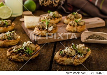 Mushroom snacks on grilled baguette Mushroom snacks on grilled baguette 39836878