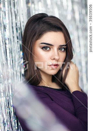 Young beautiful brunette woman portrait on silver backgound Young beautiful brunette woman portrait on silver backgound 39839506