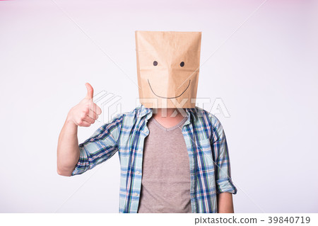 Unknown man showing thumbs up with a paper bag on Unknown man showing thumbs up with a paper bag on 39840719