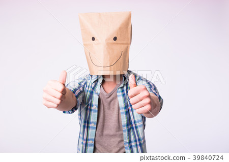 Unknown man showing thumbs up with a paper bag on Unknown man showing thumbs up with a paper bag on 39840724