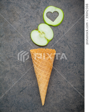 Apple slice in waffle cones and heart shape. 39842308