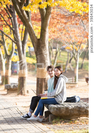 College students couple on fall campus College students couple on fall campus 39843034