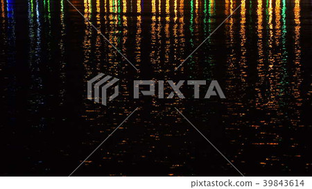 Colored night city lights on water surface. 39843614