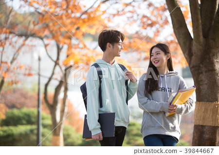 College students couple on fall campus College students couple on fall campus 39844667