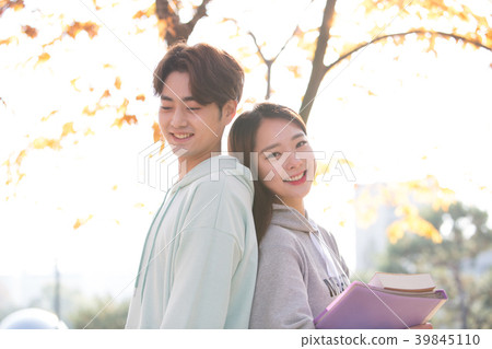 College students couple on fall campus College students couple on fall campus 39845110