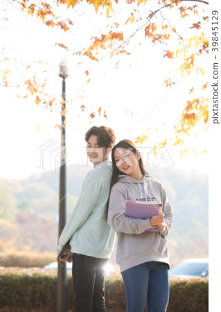 College students couple on fall campus College students couple on fall campus 39845129