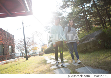 College students couple on fall campus College students couple on fall campus 39845350