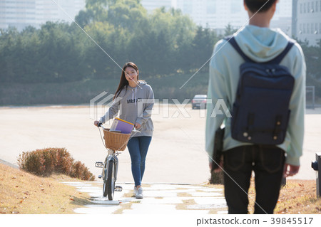 College students couple on fall campus College students couple on fall campus 39845517