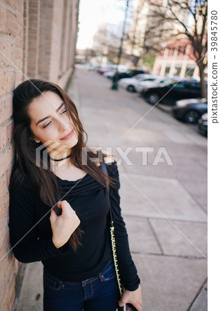 girl walks down the street 39845780
