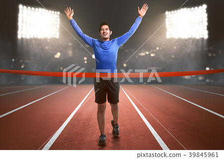 Happy asian athlete man running to finish line Happy asian athlete man running to finish line 39845961