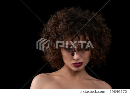Exotic curly girl looking at camera. Exotic curly girl looking at camera. 39846570
