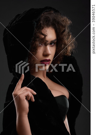 Passionate curly girl posing in black jacket. Passionate curly girl posing in black jacket. 39846571