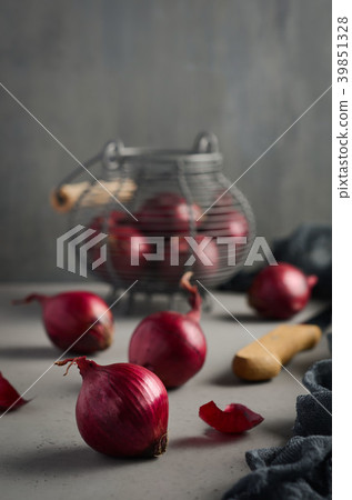 Red onions on the dark gray concrete background. Red onions on the dark gray concrete background. 39851328