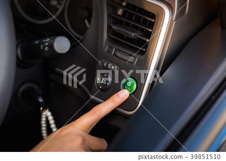 Close-up portrait of woman finger pressing switch  39851510