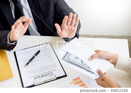 Businessman refusing or rejecting money in the envelope - anti b Businessman refusing or rejecting money in the envelope - anti b 39852280