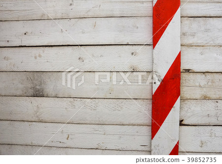 Red and white wooden barriers placed along 39852735