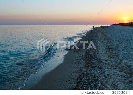 Sunset above camping on Azov sea sandy shore Sunset above camping on Azov sea sandy shore 39853054