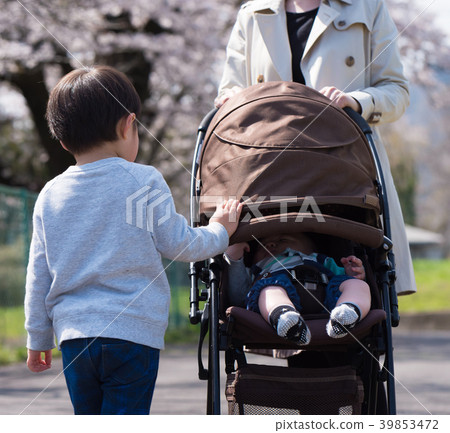 With a child. With a child. 39853472