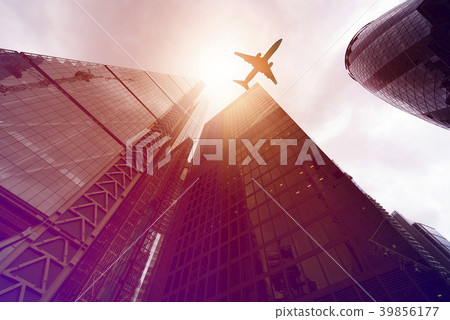 plane over highrise buildings plane over highrise buildings 39856177