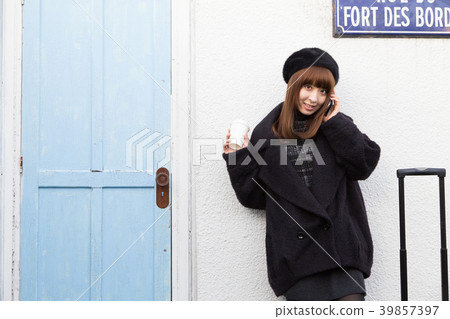 Woman operating a smartphone 39857397