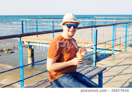 lifestyle, drinks and people concept - man in 39857648