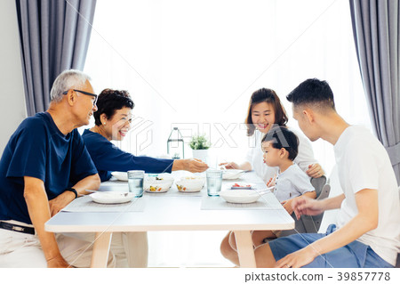 Happy Asian extended family having meal at home Happy Asian extended family having meal at home 39857778