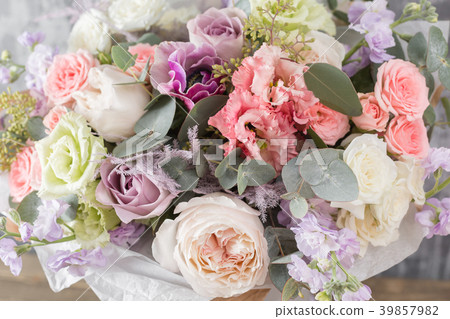 Close-up Beautiful Bouquet. Spring flowers on gray Close-up Beautiful Bouquet. Spring flowers on gray 39857982