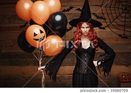 Halloween Witch Concept - Beautiful caucasian Halloween Witch Concept - Beautiful caucasian 39860709