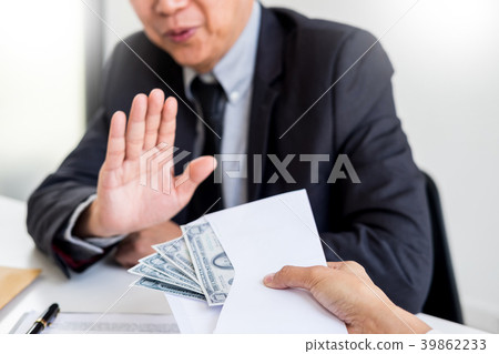 Businessman refusing or rejecting money in the envelope - anti b Businessman refusing or rejecting money in the envelope - anti b 39862233