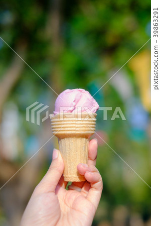 Ice cream made from fruit held in his left hand Ice cream made from fruit held in his left hand 39863291
