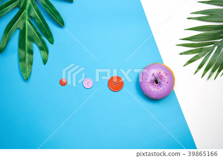 Purple donut and colorful on a blue background. Purple donut and colorful on a blue background. 39865166