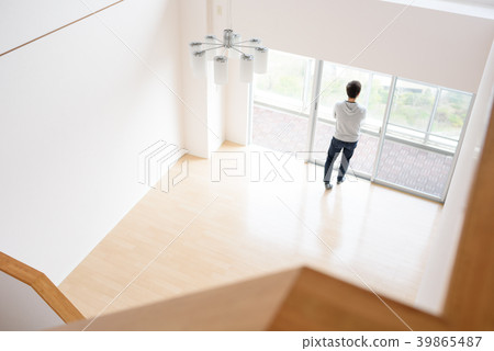 A man standing in the living room A man standing in the living room 39865487