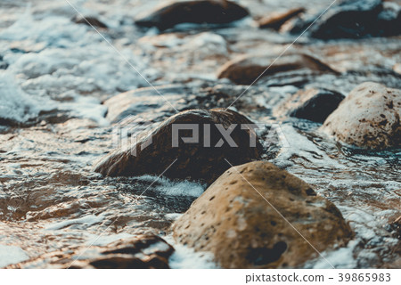 Rocky shore of the beach with waves crashing 39865983