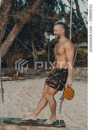 Handsome man standing on the swing with pandan 39866032