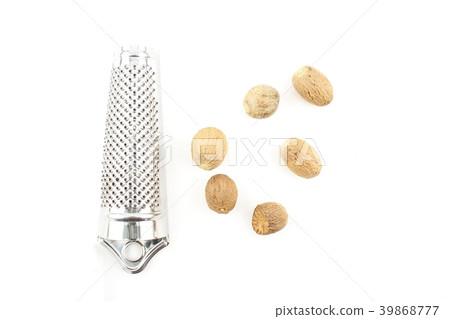 nutmeg seeds isolated on a white background 39868777
